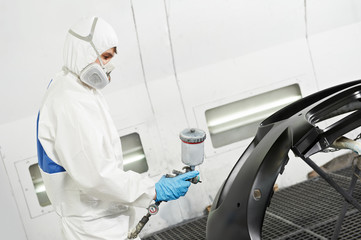 auto mechanic painting car bumper