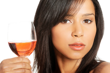 Beautiful woman with glass of rose wine