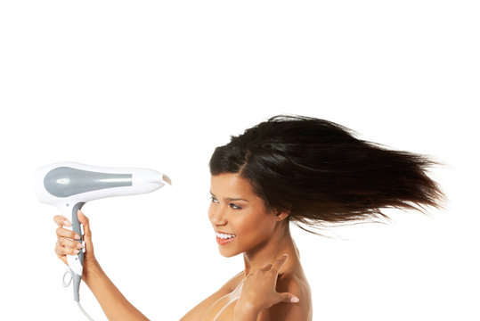 Woman With Long Hair Holding Blow Dryer