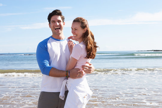 Couple Having Fun On Beach Holiday