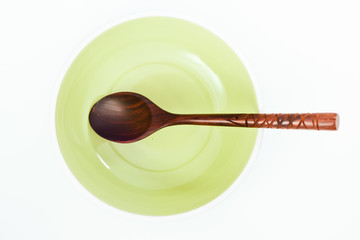 Empty plate with spoon