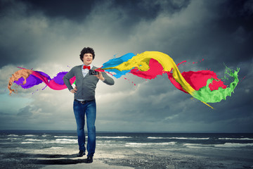 Young man with photo camera