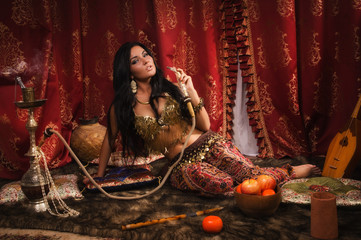 Beautiful arabic woman with hookah