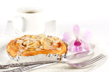 Delicious danish pastry with a cup of black coffee