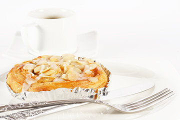 Delicious danish pastry with a cup of black coffee