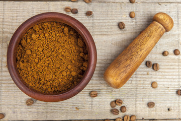 Mortar and pestle with brown coffee