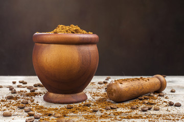 Mortar and pestle with brown coffee