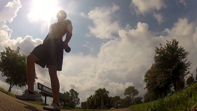 HD: man stretching outdoors - lunge.