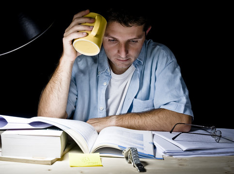 Young Man Studying at Night