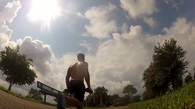 HD: man stretching outdoors - lunge.