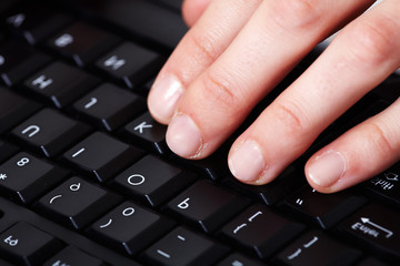 Hands with a computer keyboard.