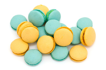 Fototapeta na wymiar blue and yellow macarons over white
