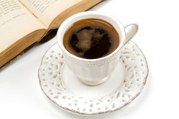 cup of coffee and old book