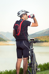 Mountain biker beside a beautiful lake