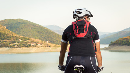 Mountain biker beside a beautiful lake