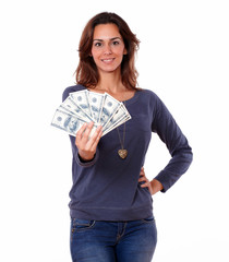 Charming young woman holding cash money