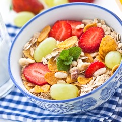 Muesli with strawberry and grapes