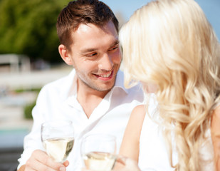 couple drinking wine in cafe