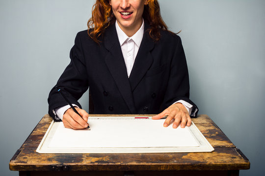 Businesswoman working at drawing board