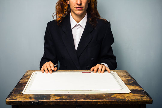 Businesswoman at drawing board