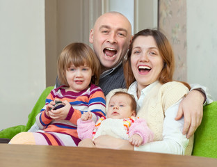 Obraz premium Happy couple together with children