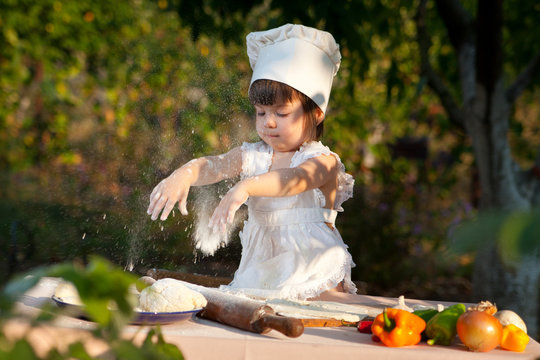 Little chef makes the dough