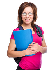 Young student girl is holding book