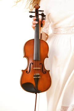 Female hand with a violin outdoor