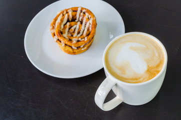 Latte on the black table