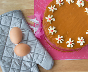 The eggs and tea cake on wood bench