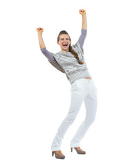 Full length portrait of happy woman in sweater rejoicing success