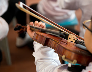 playing the violin.