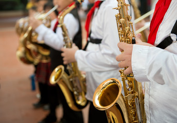 playing the saxophone.