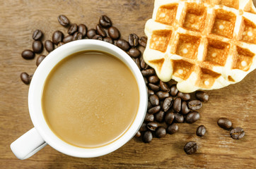 Coffee cup with grains and waffle