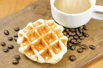 Coffee cup with grains and waffle