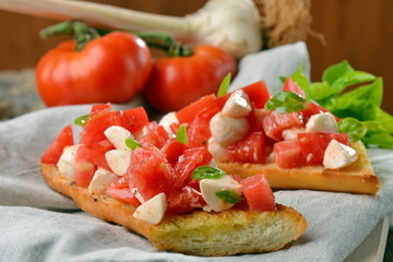 Fresh homemade crispy Italian antipasto called Bruschetta