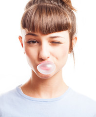 girl doing a bubble with a chewing gum on a white background