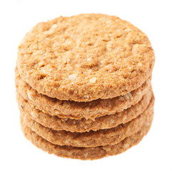a pile of oats biscuits on a white background