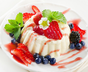 Delicious dessert with fresh berries and mint