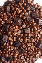 Sliced dry chicory root and coffee beans