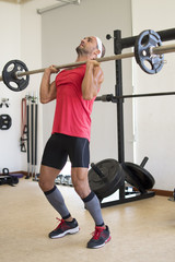 Fototapeta premium Athlete lifting weights