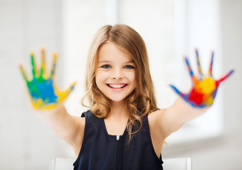 girl showing painted hands