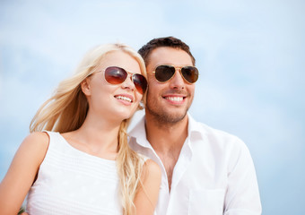 couple in shades at sea side
