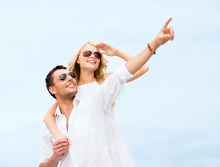 couple in shades at sea side