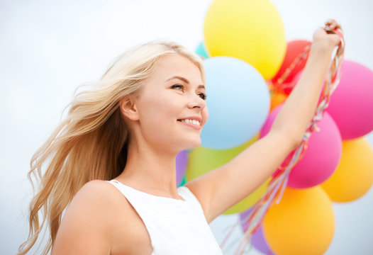 Woman With Colorful Balloons Outside