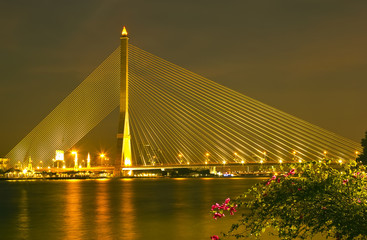Fototapeta na wymiar The Rama eight bridge at night in Bangkok