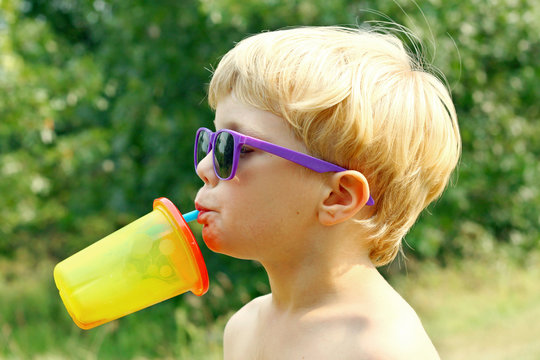 Child Drinking on Hot Summer Day