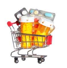 Pill bottle and pills in shopping cart isolated. Pharmacy