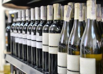 Red and white wine in bottles