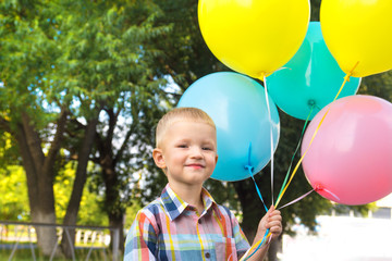 Little boy with balloons